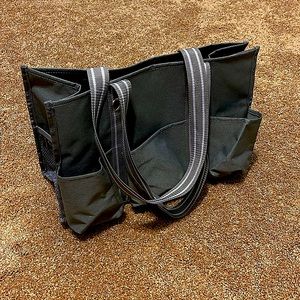 Thirty-One Utility Tote. Gray w/gray and white stripe handles.  7 total pockets.